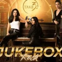 Three people around a piano. "JukeBox"