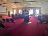 Commission Chambers facing the podium and windows