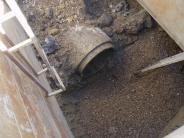 Preping for a storm drain manhole installation.