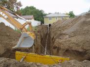Residential sewer service installation.