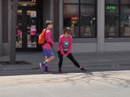 A runner stretches before the race begins.