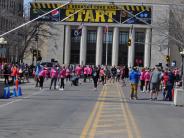 Runners mill about near the start line as they wait for the race to begin.