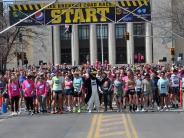 Runners line up at the start of the Ice Breaker Road Race. 