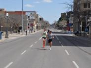 The two front runners in the Ice Breaker Road race continue down the street