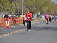 Several runners are shown in the stretch before reaching the finish line