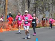 Several runners are shown in the stretch before reaching the finish line