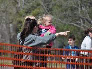 A family watches the race from the sidelines