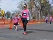 A mother and daughter are shown walking in the race
