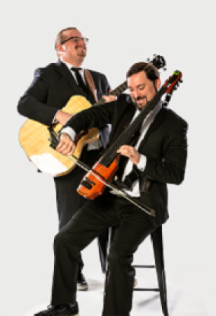 Mike and Greg happily playing music on the guitar and a violin, the violist is on a stool