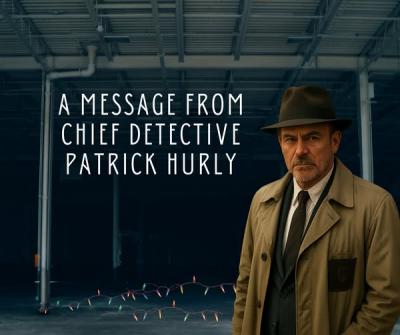 "Chief detective Hurly" in a trench coat and hat